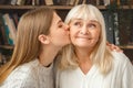 Granddaughter taking care of her retired grandmother kiss