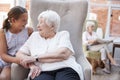Granddaughter Visiting Grandmother In Retirement Home Royalty Free Stock Photo