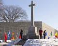 Officers standing guard at the Cross of Sacrifice