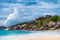 Grande Anse beach, La Digue island, Seychelles. Amazing natural landscape of paradise island and impressive clouds Royalty Free Stock Photo