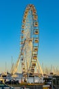 Grande Roue Ferris Wheel at Promenade de la Pantiero square aside yacht port in Cannes in France