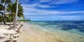 People taking ocean bath on the beautiful beach of Petit Havre beach in south on Grande-Terre on Guadeloupe island