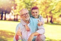 Grandfather and boy showing thumbs up at summer Royalty Free Stock Photo