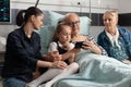 Grandfather browsing on internet with little granddaughter using modern smartphone Royalty Free Stock Photo