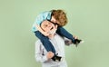 Grandfather carries grandson on shoulders on green background isolated. Men generation, Royalty Free Stock Photo