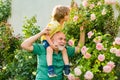 Grandfather carrying his grandson having fun in the park at the summer time. Happy grandfather and grandson relaxing Royalty Free Stock Photo