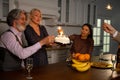 Grandfather celebrating his birthday with cake, candles and sparklers Royalty Free Stock Photo