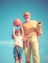 Grandfather and child is doing sport outdoors. Motivation and sport concept. Father and son sporting - family time Royalty Free Stock Photo