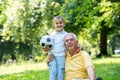 Grandfather and child have fun in park Royalty Free Stock Photo