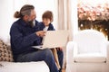 Grandfather, child or laptop on couch to relax, love or bonding together for cartoon in living room. Happy family, boy