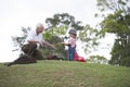 Grandfather and child planting tree in park family togetherness Royalty Free Stock Photo