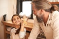 Grandfather, child and portrait for cookie in kitchen, learning and skill development in home. Grandpa, kid and smile Royalty Free Stock Photo