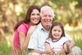Grandfather, Daughter And Granddaughter In Park Royalty Free Stock Photo