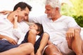 Grandfather,Father And Grandson Sitting Outdoors At Home Royalty Free Stock Photo