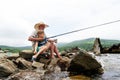 Grandfather fisher in straw hat and little male grandkid enjoying leisure activity use fishing rod Royalty Free Stock Photo