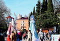 Grandfather frost and snow maiden are on the area of the city of Tuapse to the tree and rise above the audience.