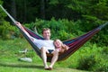 Grandfather and girl in hammock Royalty Free Stock Photo