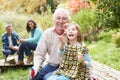 Grandfather And Granddaughter Blowing Bubbles Royalty Free Stock Photo