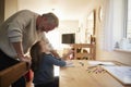 Grandfather And Granddaughter Colouring Picture Together Royalty Free Stock Photo