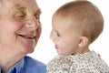 Grandfather and granddaughter holding hands