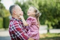 grandfather with granddaughter. Multi generation family enjoying in the park. Royalty Free Stock Photo