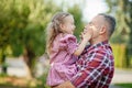 grandfather with granddaughter. Multi generation family enjoying in the park. Royalty Free Stock Photo