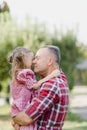 grandfather with granddaughter. Multi generation family enjoying in the park Royalty Free Stock Photo