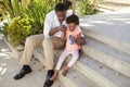 Grandfather And Granddaughter Playing With Bubbles Together Royalty Free Stock Photo