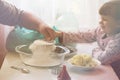 Grandfather and granddaughter sifted flour