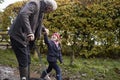 Grandfather And Granddaughter Taking Dog For Walk Royalty Free Stock Photo