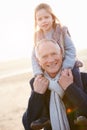 Grandfather And Granddaughter Walking On Winter Beach Royalty Free Stock Photo