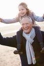 Grandfather And Granddaughter Walking On Winter Beach Royalty Free Stock Photo