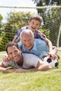 Grandfather, Grandson And Father With Football In Garden Royalty Free Stock Photo