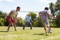 Grandfather, Grandson And Father Playing Football In Garden Royalty Free Stock Photo