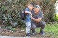 Grandfather and grandson going to school. Royalty Free Stock Photo