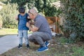 Grandfather and grandson going to school. Royalty Free Stock Photo