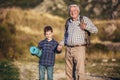 Grandfather and grandson holding hands while hiking Royalty Free Stock Photo