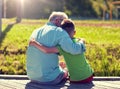 Grandfather and grandson hugging on berth Royalty Free Stock Photo