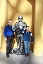 Grandfather and grandson with iron knight