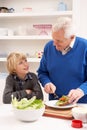 Grandfather And Grandson Making Sandwich Royalty Free Stock Photo