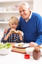 Grandfather And Grandson Making Sandwich Royalty Free Stock Photo