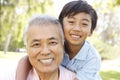 Grandfather With Grandson In Park