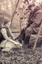 Grandfather and grandson play with a dog Royalty Free Stock Photo