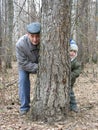 Grandfather and grandson play hide-and-seek