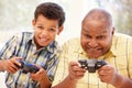 Grandfather and grandson playing computer games Royalty Free Stock Photo