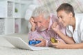 Grandfather and grandson playing computer games Royalty Free Stock Photo