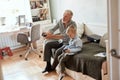 Grandfather and grandson playing video games on computer with joystick Royalty Free Stock Photo