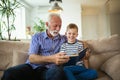 Grandfather With Grandson Reading Together Royalty Free Stock Photo