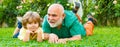Grandfather and grandson, spring banner. Two different generations ages: grandfather and grandson together. Grandpa Royalty Free Stock Photo