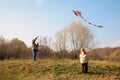 Grandfather and grandson start kite